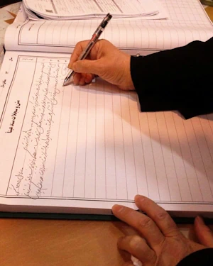 A mother signing forbearance.